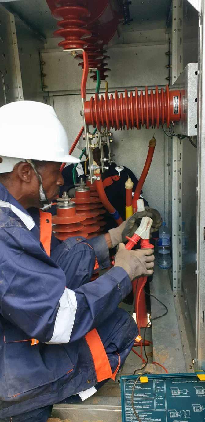 KELM technicians working on MV protection equipment